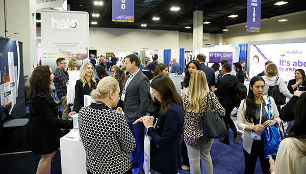 Photo of attendees on the exhibit floor